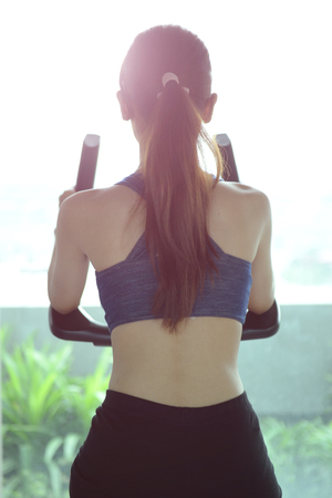 Exercise in the gym, women want to have a beautiful body with fitness.の写真素材