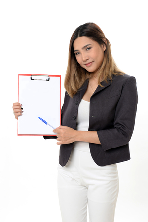 Young business woman holding a document standing with confident.の写真素材
