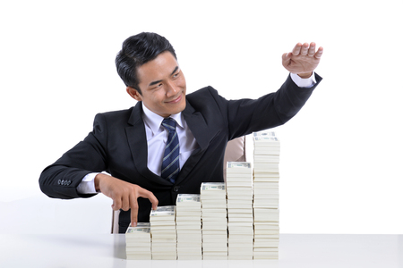 Young businessman With the stock market and the currencyの写真素材