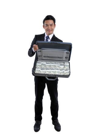 Young businessman With the stock market and the currencyの写真素材