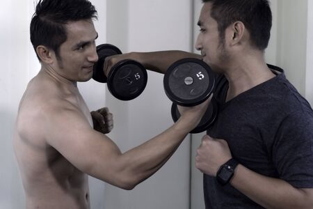 Twins with exercise And build muscle to look better.の写真素材