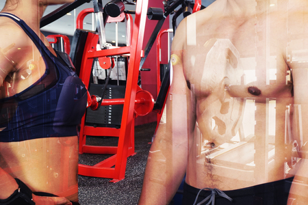 Exercise in the gym, man and women want to have a beautiful body with fitness.の写真素材