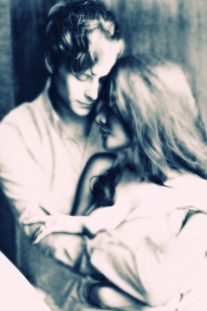 Couples express love by embracing and kissing.の写真素材