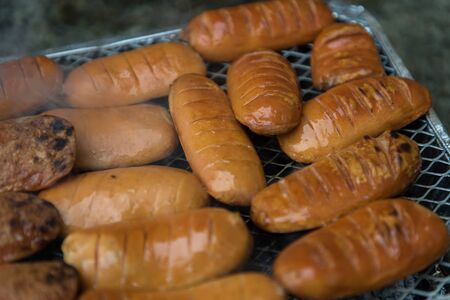 Preparation of Slovak  Czech special sausages on barbeque.の写真素材