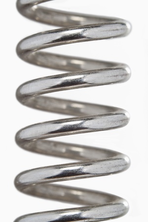 Metal spring isolated on whiteの写真素材
