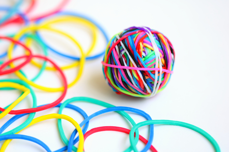 Colorful rubber band ball on white background