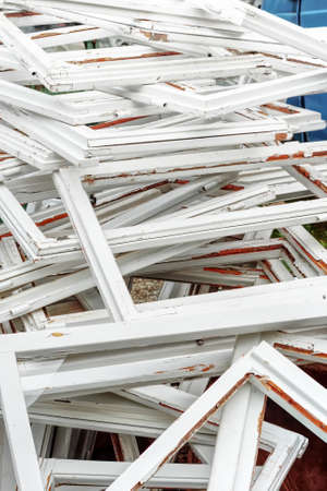 Construction and reconstruction concept, replacing windows. Heap of old wooden window framesの写真素材