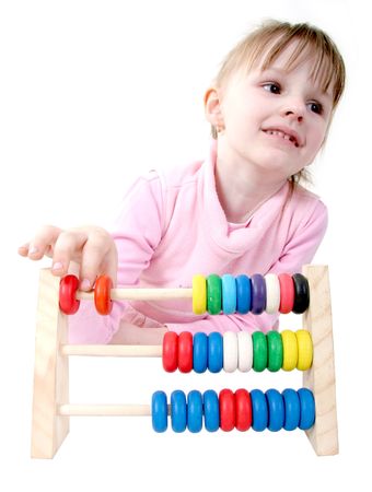 isolated little girl make some calculation with toy coloured wooden abacusの写真素材