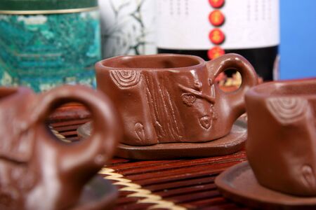 brown clay cups for tradition chinese and japanese tea ceremony stay on the bamboo tea-trayの写真素材