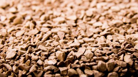 the background textured of coffee crystals close-up