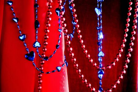 the blue and red beads of decorative hearts and ballsの写真素材