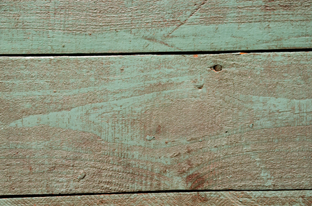 the green old cracked paint on the wooden banchの写真素材