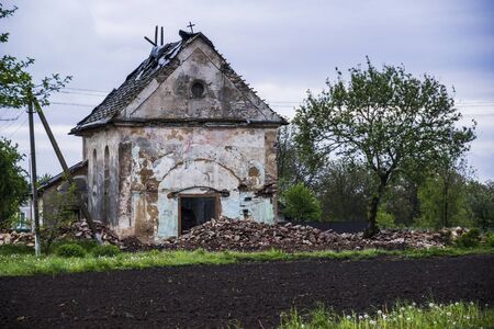 old ruined catholic church in western Ukraine villageの写真素材