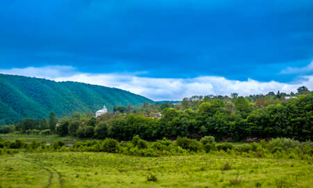 landscape with church in small ukrainian village on Dniester river, Ternopil region of western Ukraineの写真素材