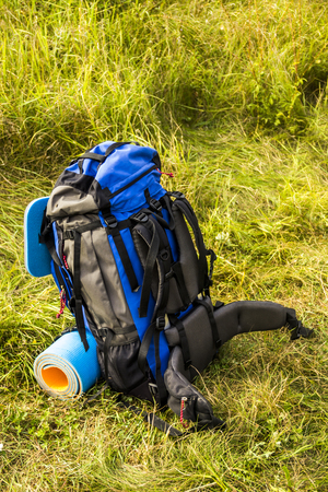 close-up of blue and grey tourist backpack at nature