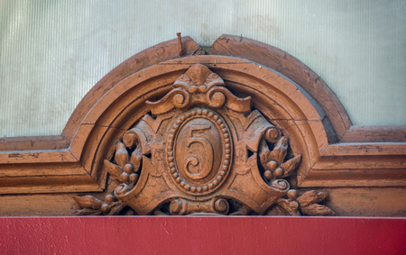 decorative old fretwork element with number of buildingの写真素材