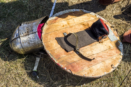 close-up a handmade shield, sword and helmet of member of the mevieval knights tournament reenactmentの写真素材