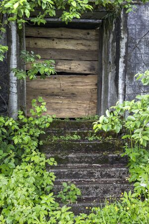 close-up closed door of abandoned houseの写真素材