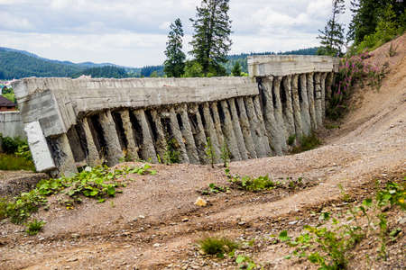 a concrete plate of building foundation on abandoned construction siteの写真素材