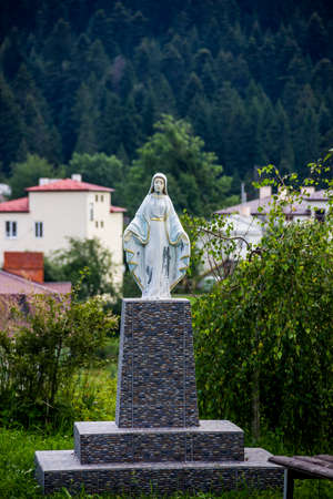 statue of Virgin Mary near the Ukrainian autocephalous Orthodox church of St.Nicholas in Skhidnytsa, Lviv region of Western Ukraineの写真素材