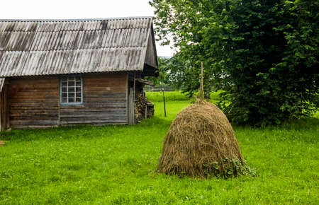 a haystack in the backyard in a Ukrainian village in the Carpathians