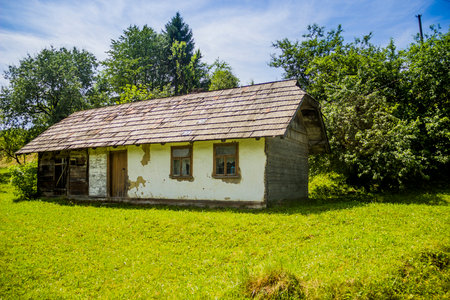 an old authentic Ukrainian village house made of clay and called mazankaの写真素材