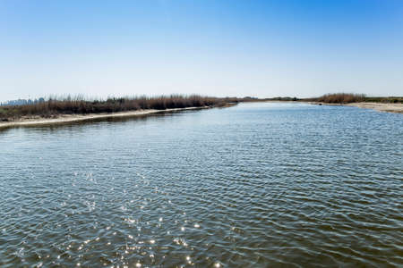 a shallow salty lagoon near the sea on the Arabat Spit on the Sea of ââAzov, Ukraineの写真素材