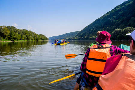 a Dnister river landscape with people on sport catamaran, National Nature Park Dnister Canyon,...