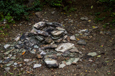 close-up of a stones and ashes at fireplace in the forest