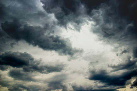 a dark grey stromy clouds in the skyの写真素材