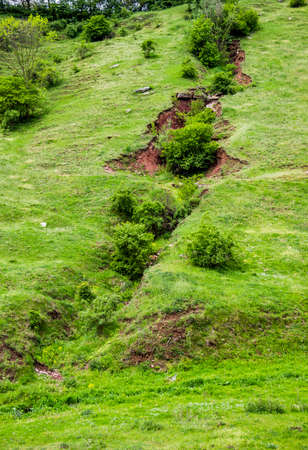 long ravine on the hill near the forest