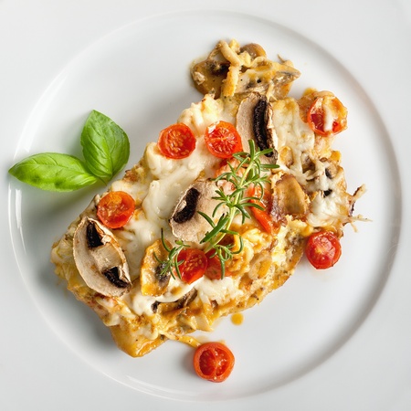 Tasty healthy fish fillet with vegetables and mushrooms