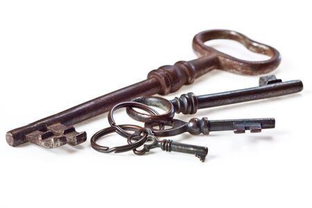 Set of antique, old fashioned keys on white backgroundの写真素材