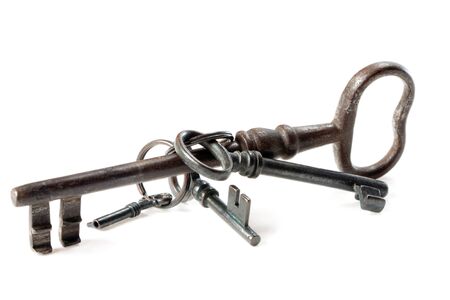 Set of antique, old fashioned keys on white backgroundの写真素材