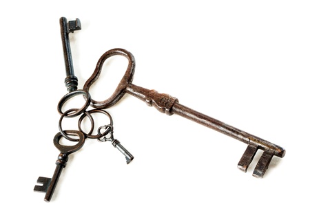 Set of antique, old fashioned keys on white backgroundの写真素材