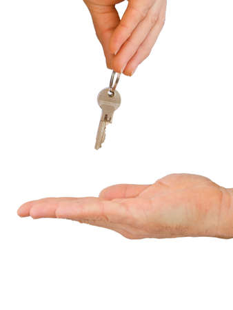 Hands and key isolated on white backgroundの写真素材
