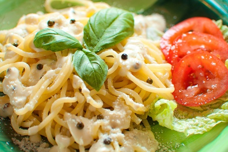 fresh hot spaghetti with cheese sauce with pepperの写真素材