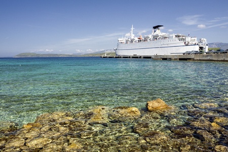 Seaside with small port and trajectの写真素材
