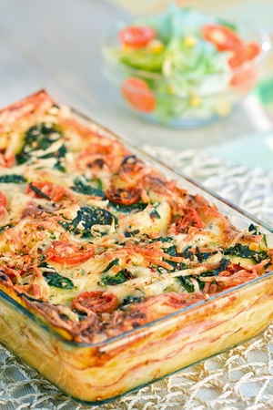 Piece of lasagna on the forkの写真素材