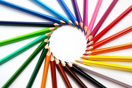 Assortment of colored pencils with shadow on white background - colored crayonsの写真素材