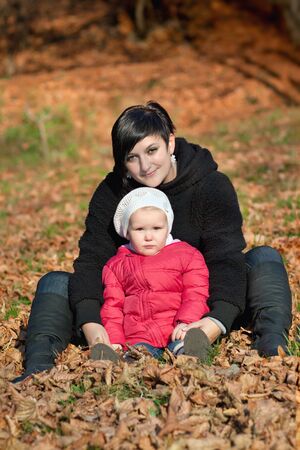 Mother with baby in the park の写真素材