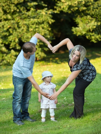 Young and happy family get stroll in the park 
の写真素材