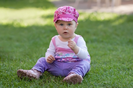 Beautiful little baby on the meadowの写真素材