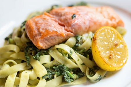 Grilled atlantic salmon fillet, with a fresh pasta salad. の写真素材