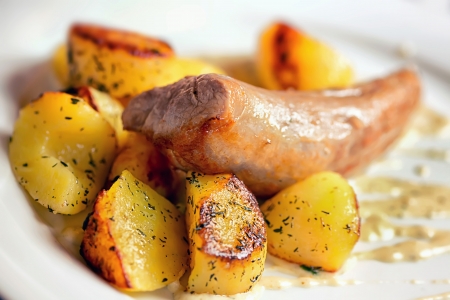 Pork tenderloin baked potatoes and vegetablesの写真素材