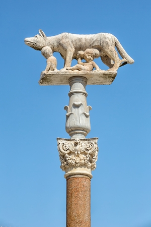 A she-wolf suckling the infants Romulus and Remus. Siena in Italy の写真素材