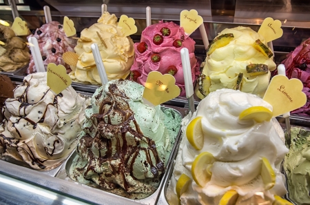 Variety of yummy ice creams under shopping window の写真素材