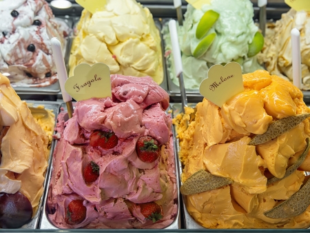 Variety of yummy ice creams under shopping window の写真素材