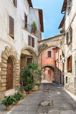 View of a beautiful little street in the old town in Tuscany, Italyの写真素材