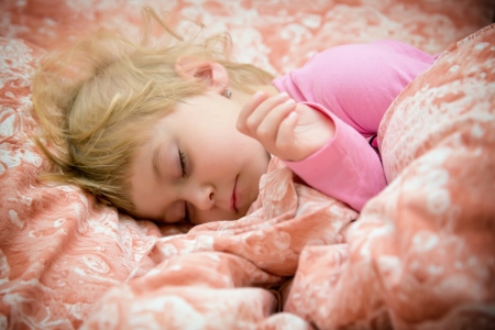 Sweet little girl and her innocent dreamsの写真素材